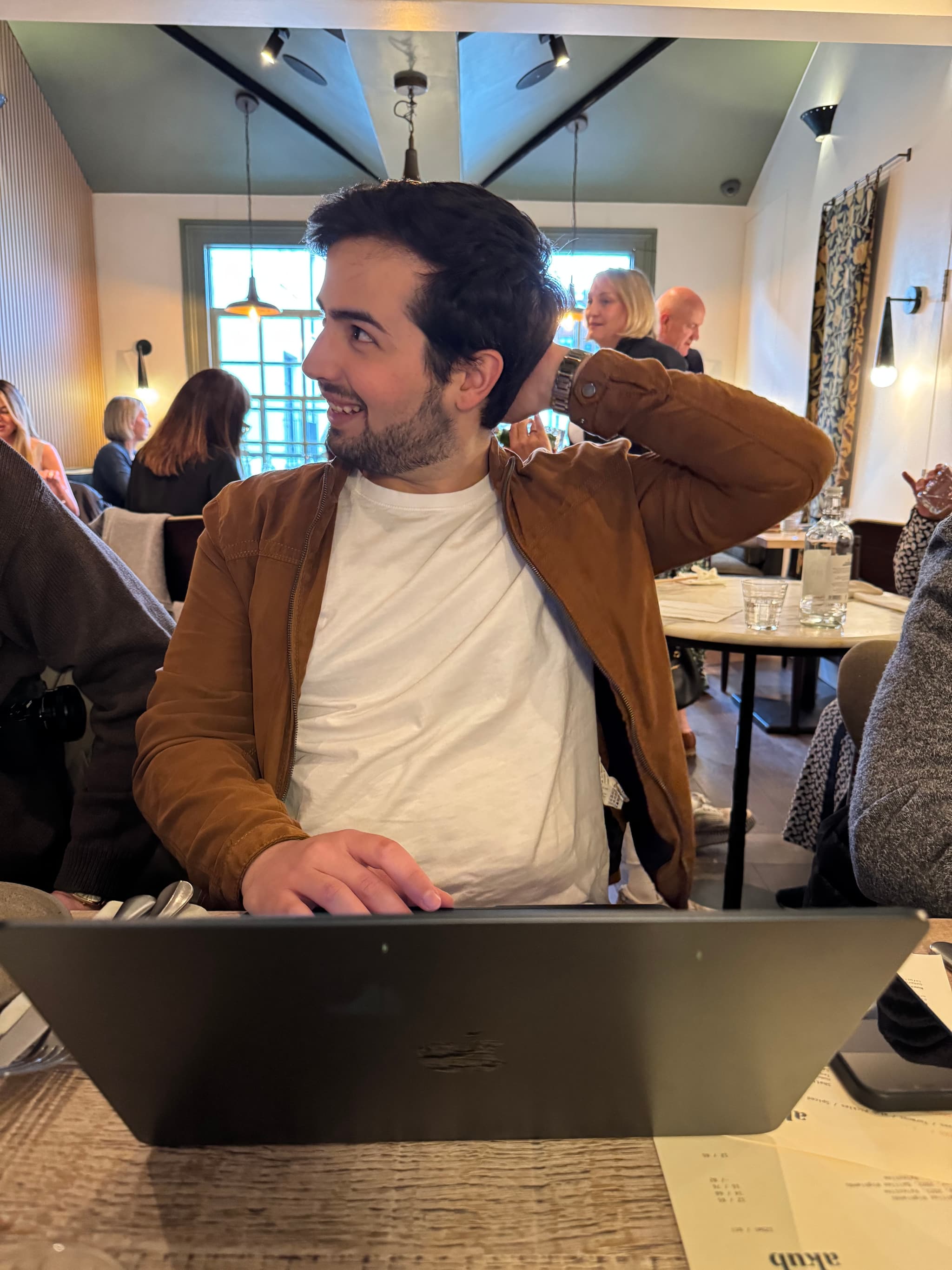 Breakfast stand-up over laptops, croissants, and strong coffee