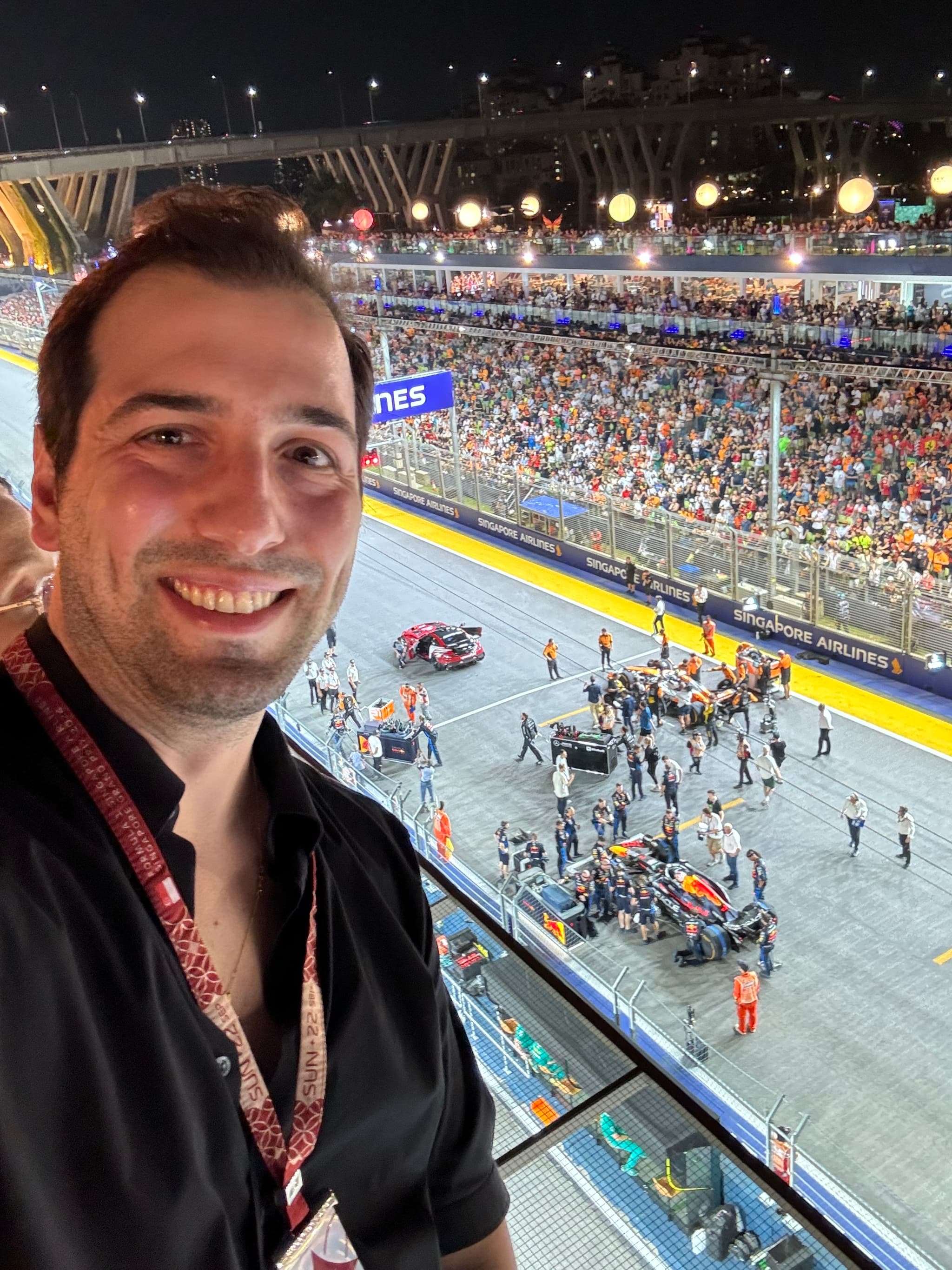 Cheering above a night-race grid